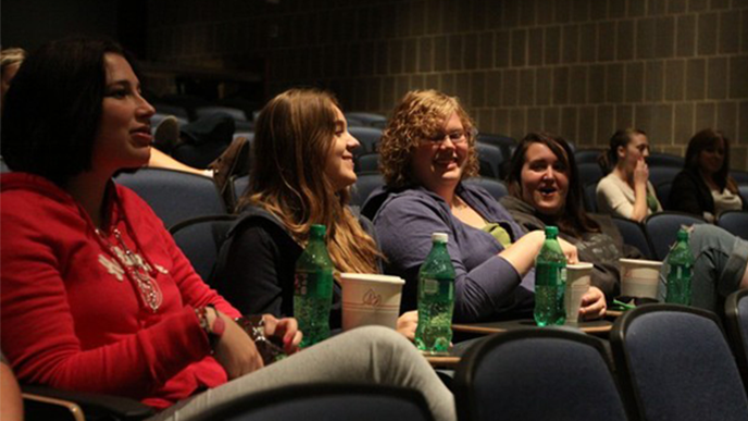 Students about to watch Cyclone Cinema in Carver Hall.